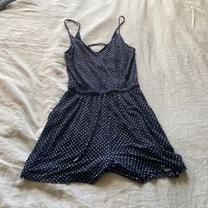 Romper with polka dot design on it in size extra small